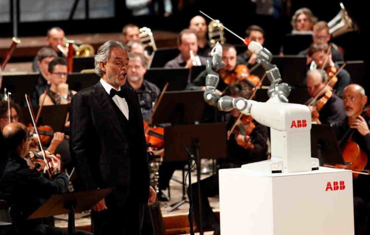 YuMi the robot conducts opera for Andrea Bocelli and the Lucca Philharmonic orchestra
