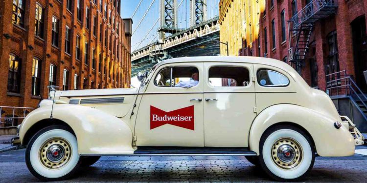 Why are there vintage cars in New York plastered with Budweiser logo?